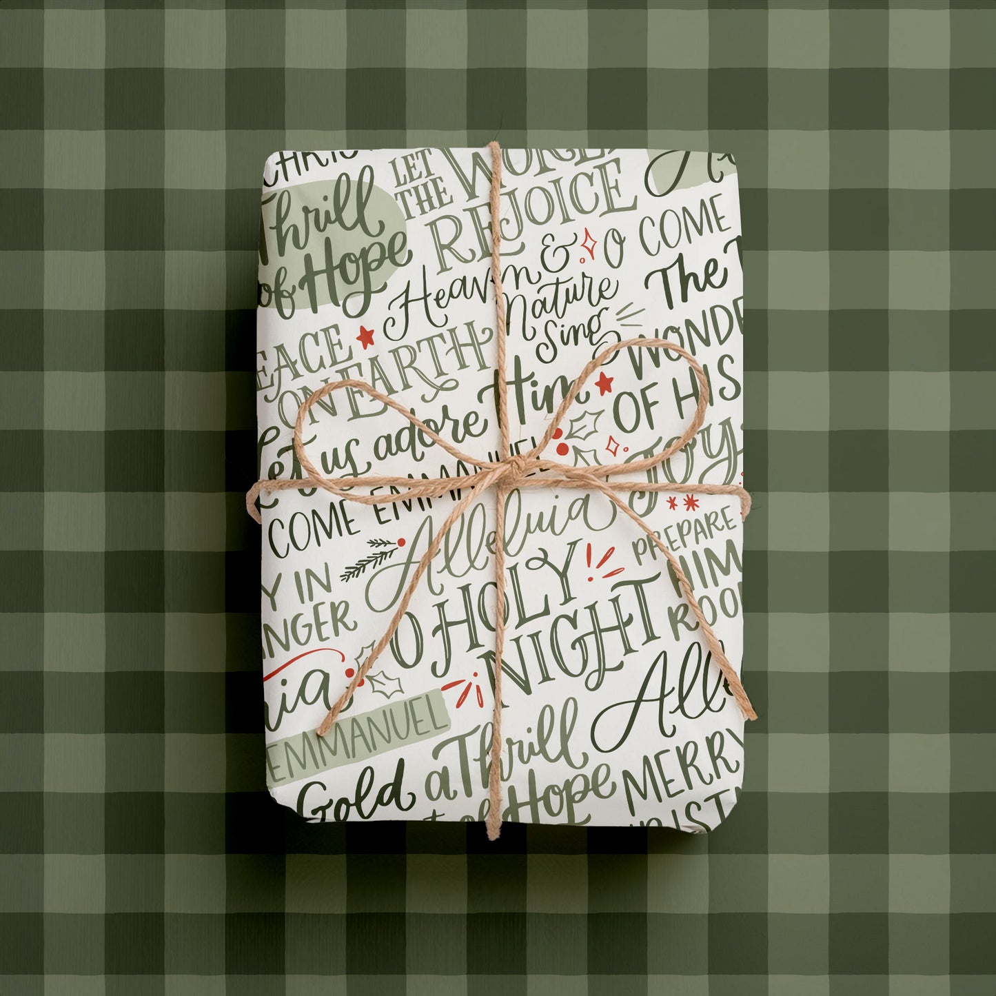 Double-sided Christmas Christian wrapping paper sheets with hand-lettered phrases with green buffalo check plaid.
