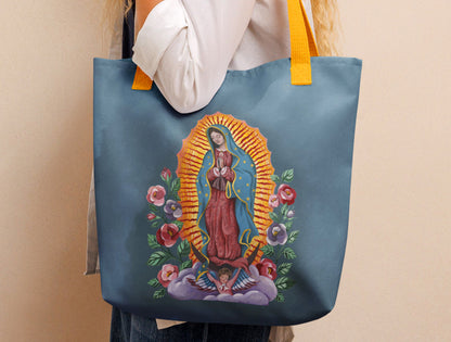 A Catholic tote bag featuring a design of Our Lady of Guadalupe. Original painting was made with gouache and then printed onto this book bag.