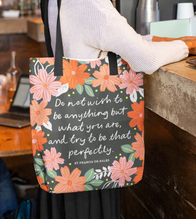 Christian tote bag featuring vibrant florals and a quote from St Francis de Sales.